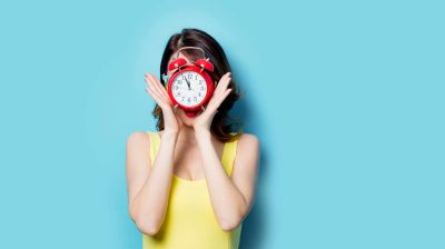clock red yellow dress lady holding blue
