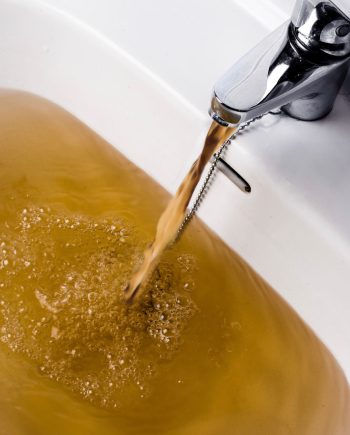 brown water tap basin flow