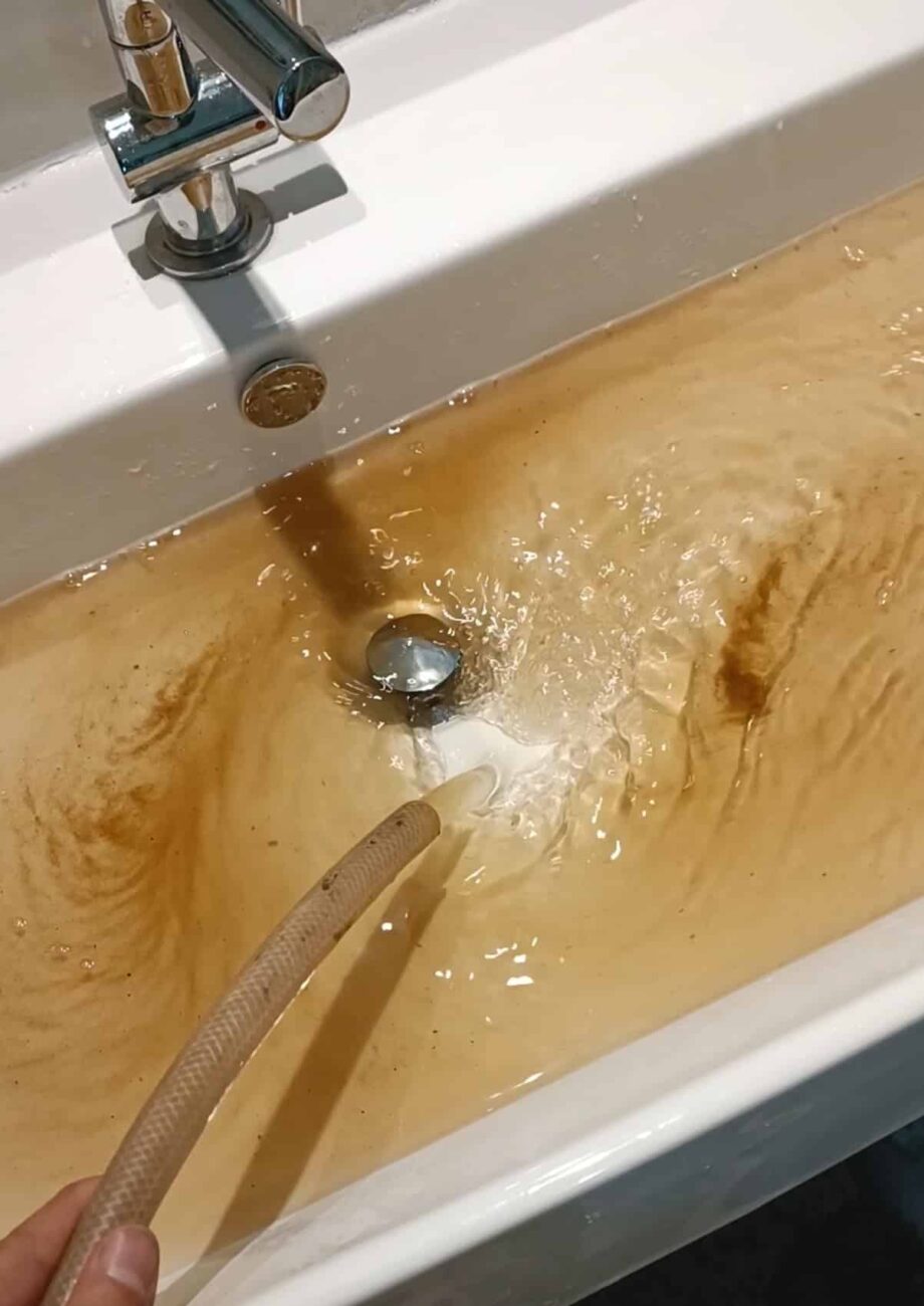 Discolored water being drained.
