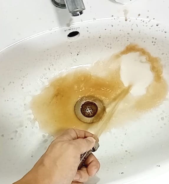 Discolored water coming out from tap.